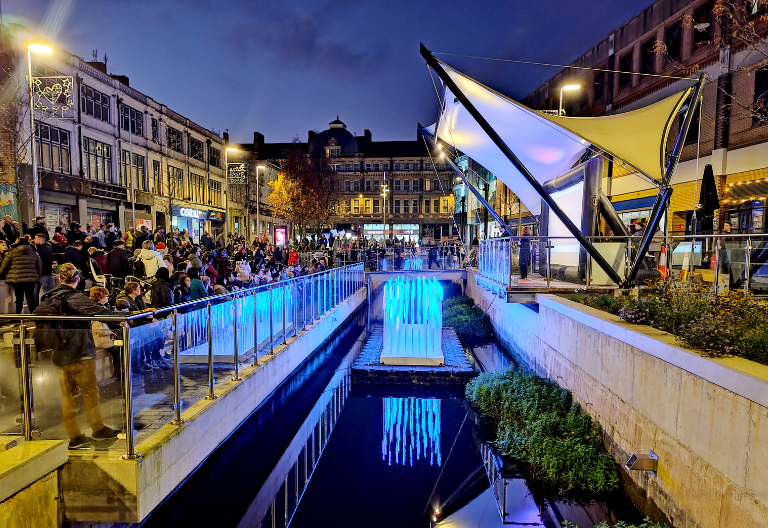 A night time photo of an event at Cardiff Canal Quarter